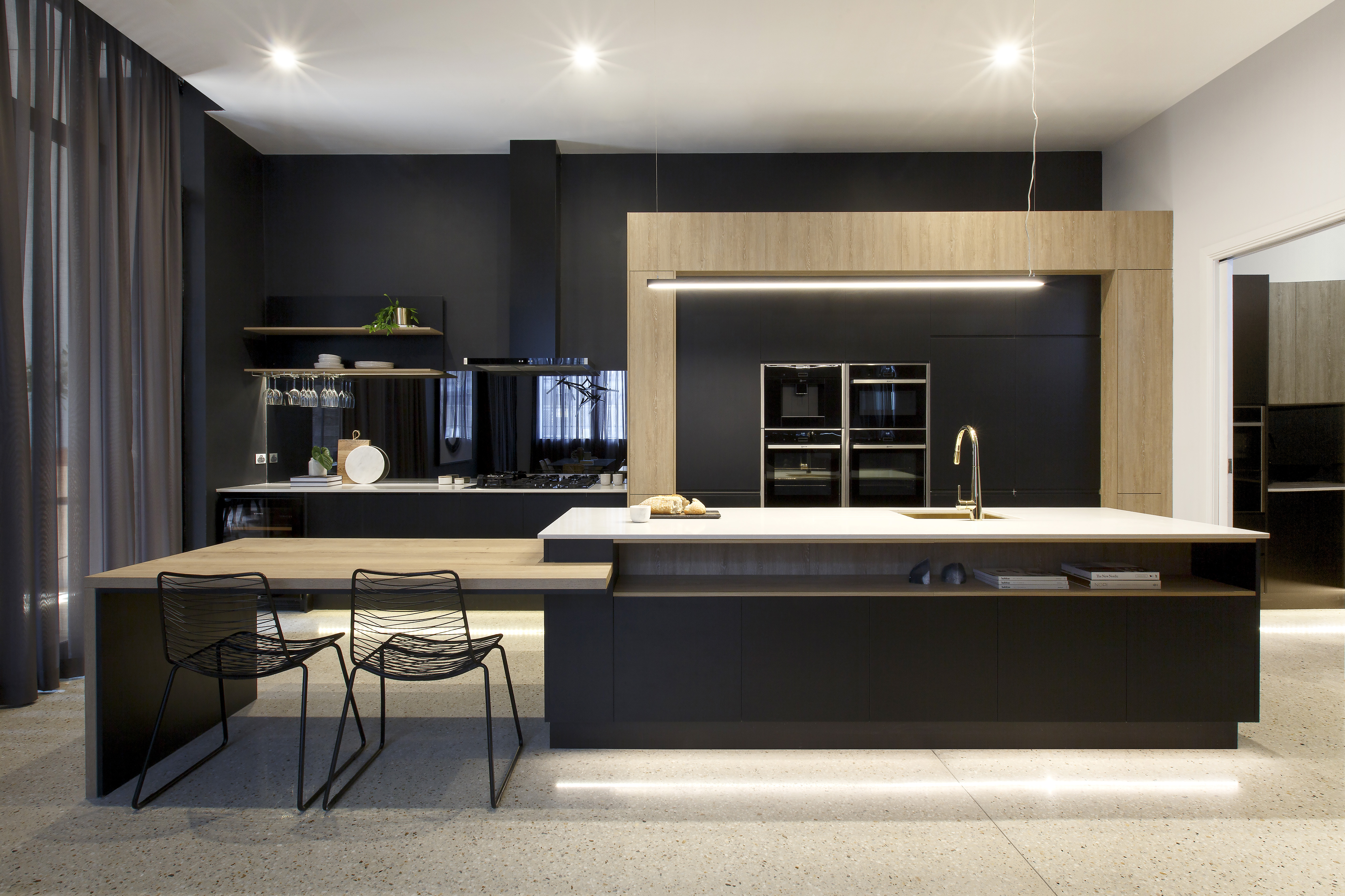 Dark and moody Entertainer Kitchen with Stylish and Spacious Island Bench
