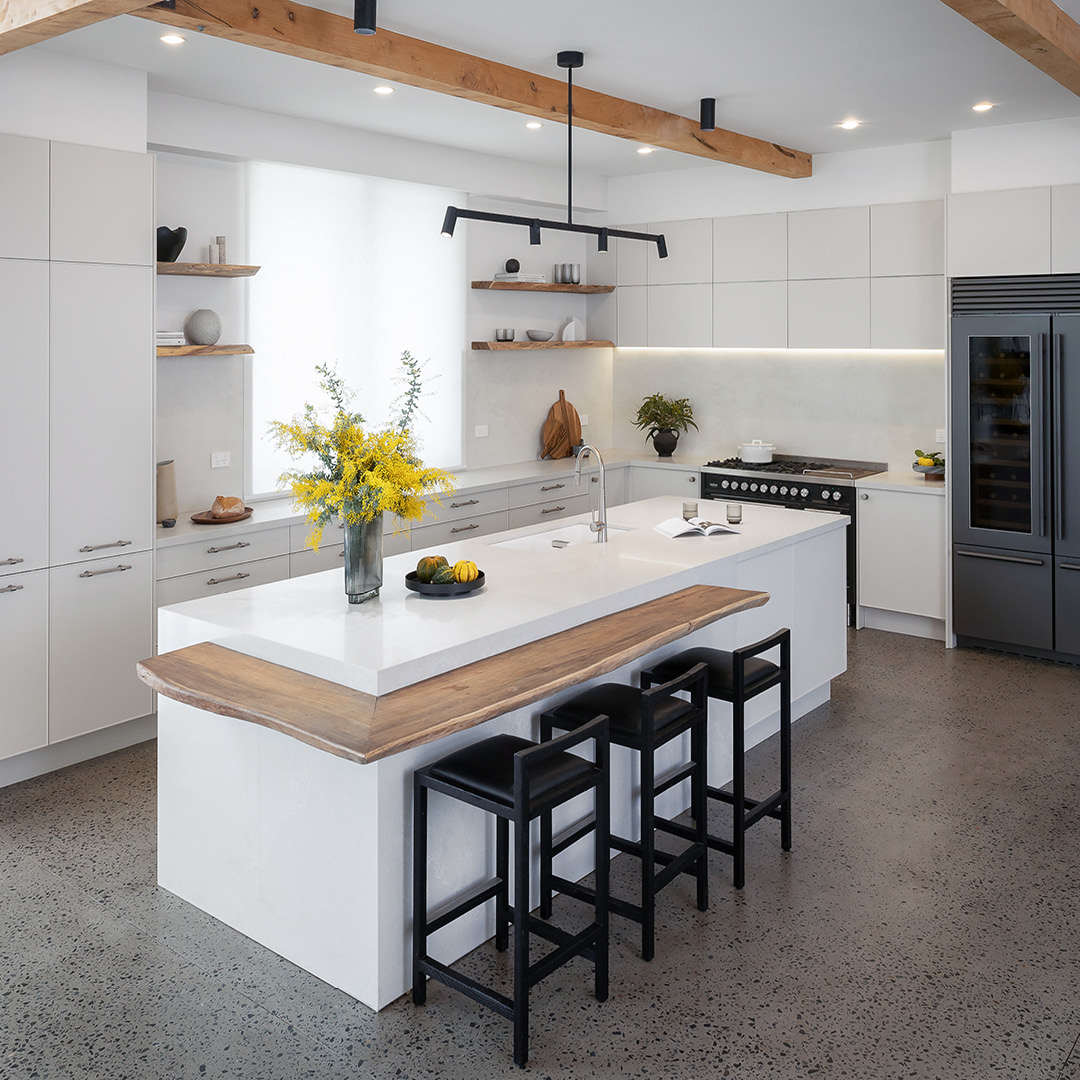 The Blocks Rachel and Ryan's L-shaped, open plan Lodge Style kitchen design with organic warm white, grey marble, and brass palette