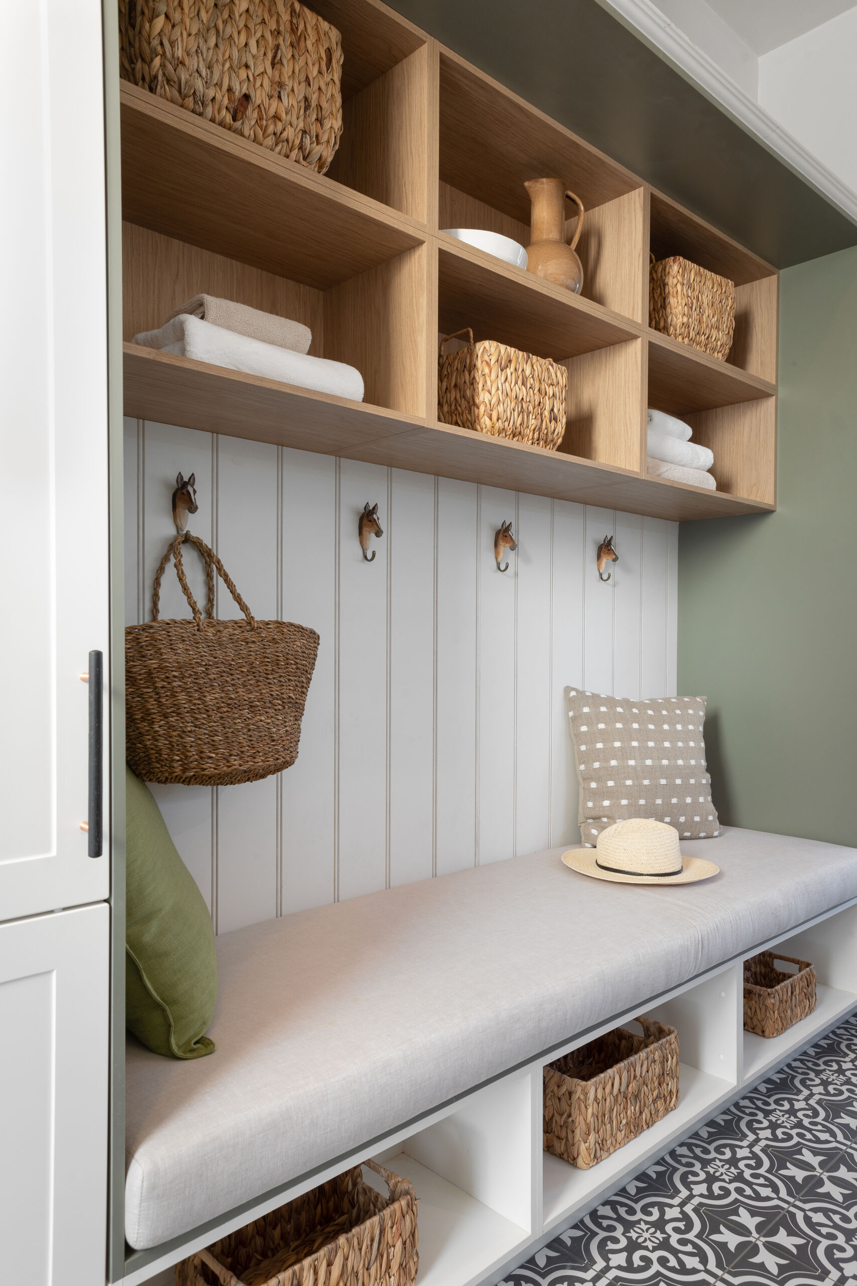  The Block 2022 Ankur and Sharon's combined mudroom laundry layout provides simple yet effective storage and seating space.