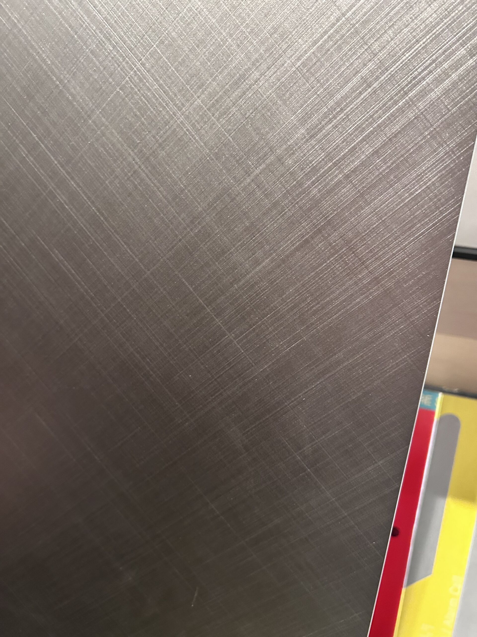 Metal textured panel for cabinetry