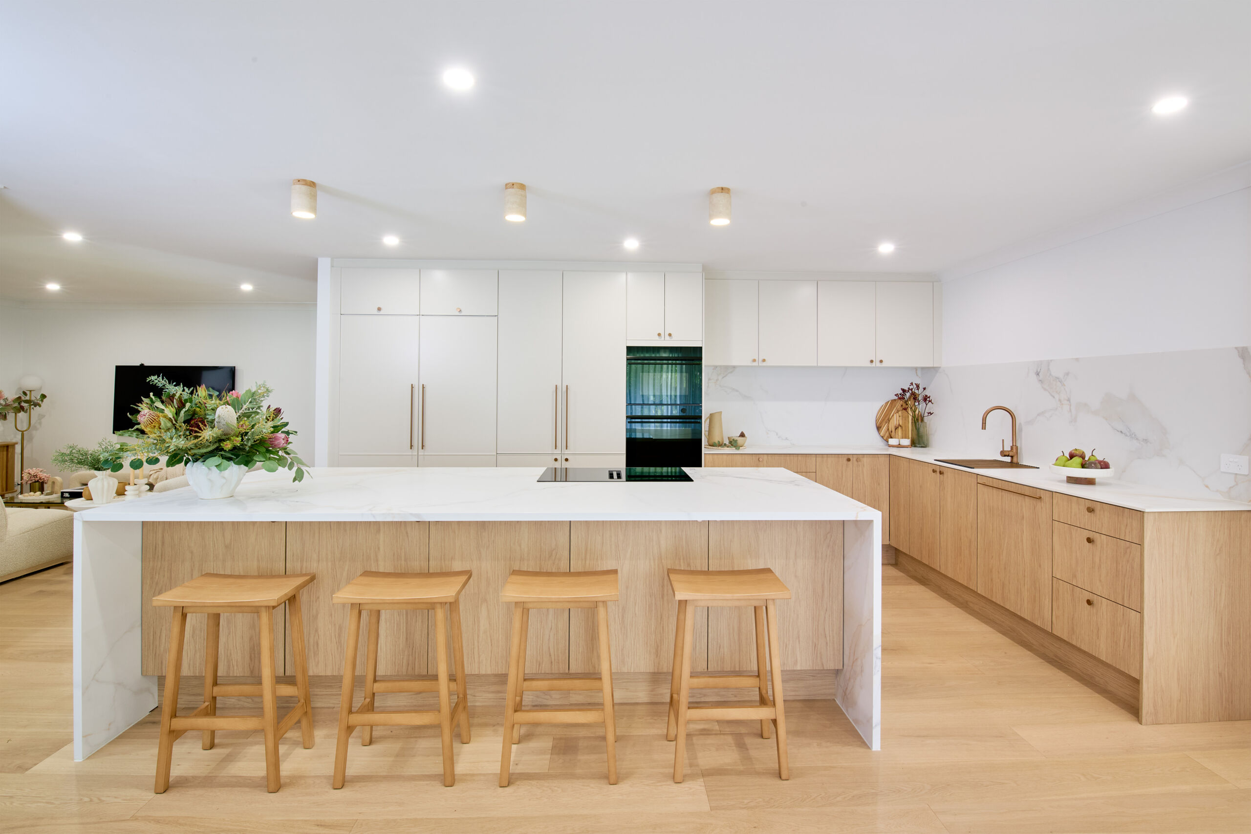 Japandi meets Coastal kitchen with warm white and timber look cabinetry.