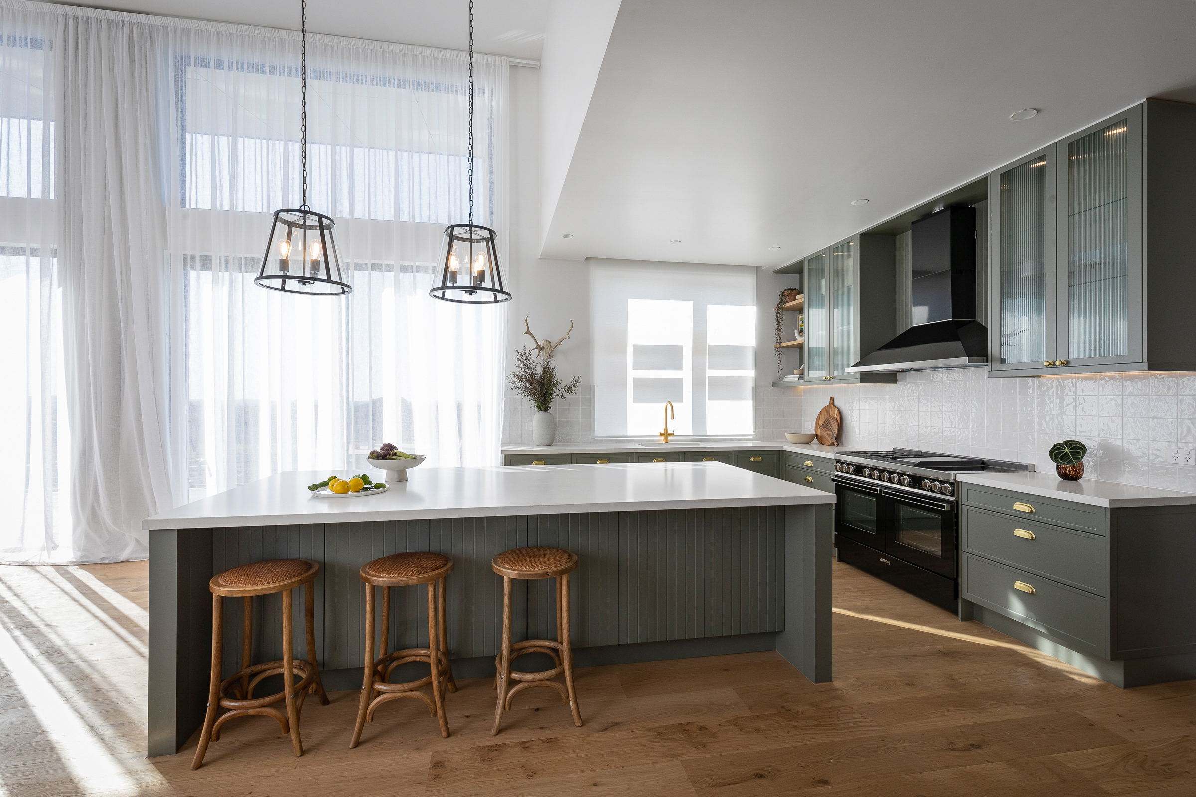 Modern Country Kitchen from The Block 2022 with panelled sage green cabinetry and fluted glass cabinetry.