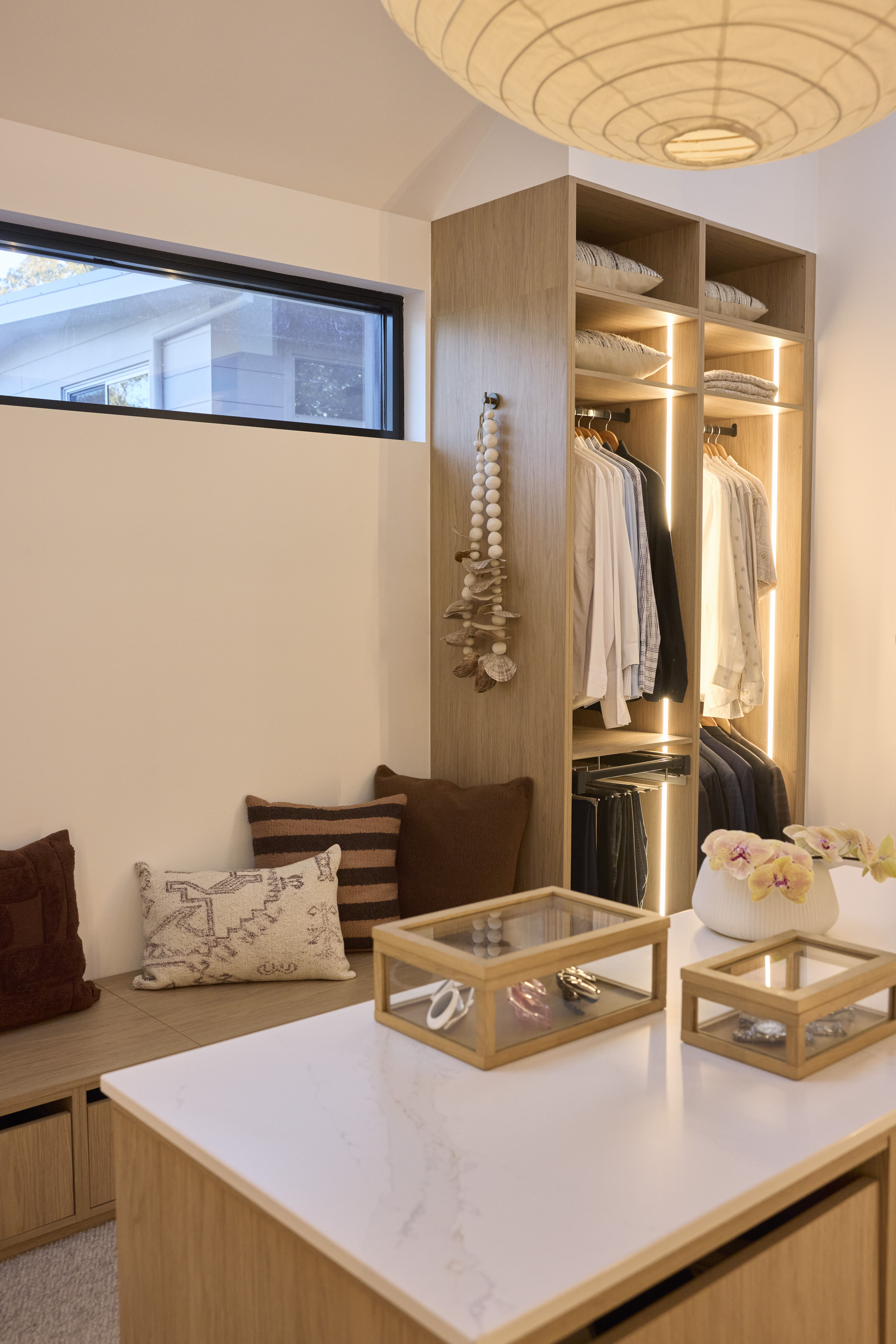 walk-in-wardrobe-with-island-bench-and-bench-seat