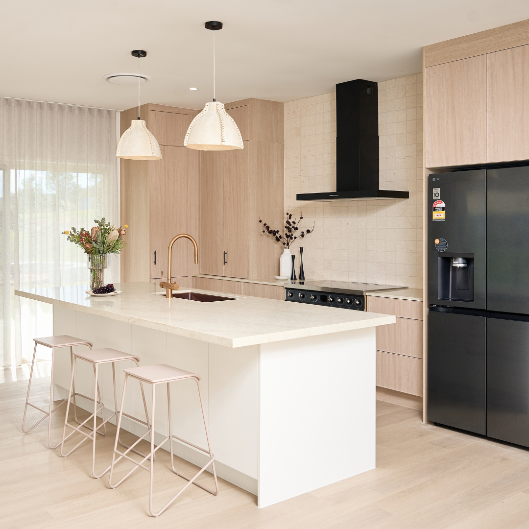 Modern kitchen with light timber kitchen cabinets and an island bench