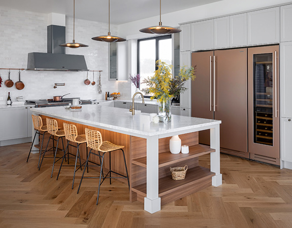 fk-block26-previous-2022 The Block 2022: White kitchen with marble island, timber flooring, rose gold appliances.