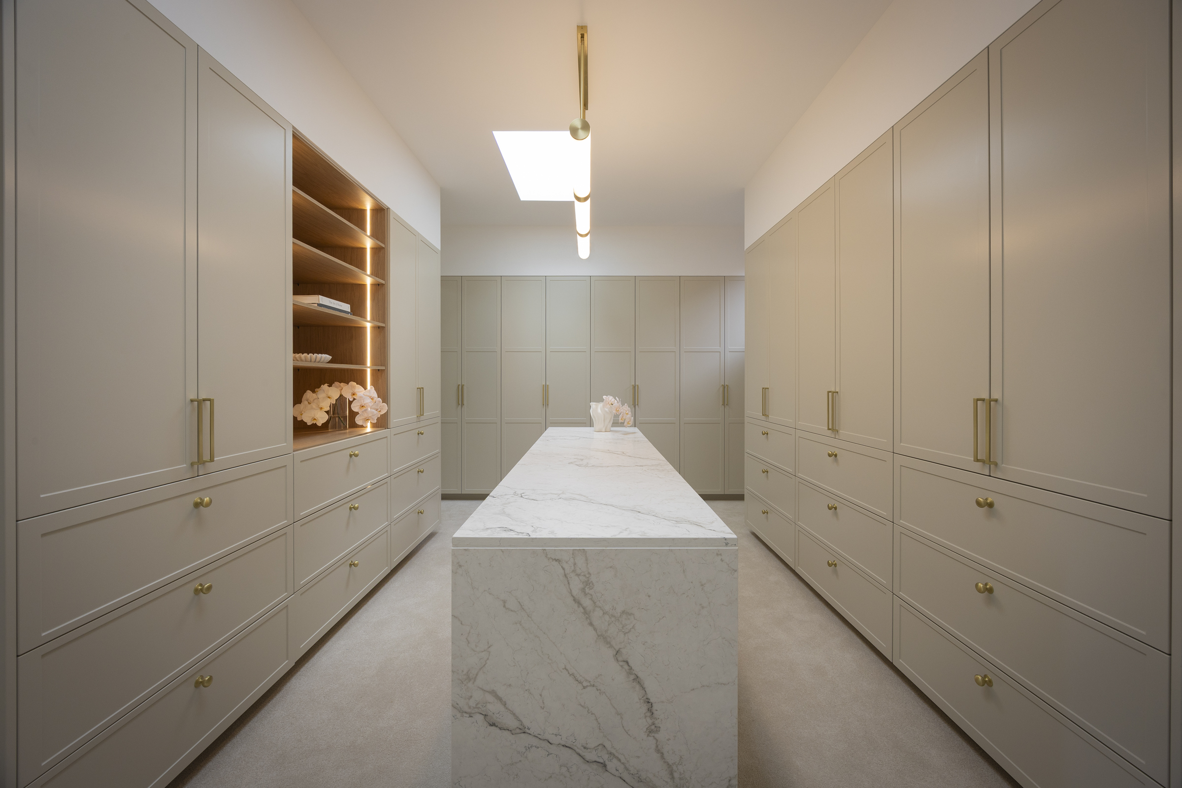 MA341 Walk in wardrobe with large island bench and grey shaker doors and gold handles