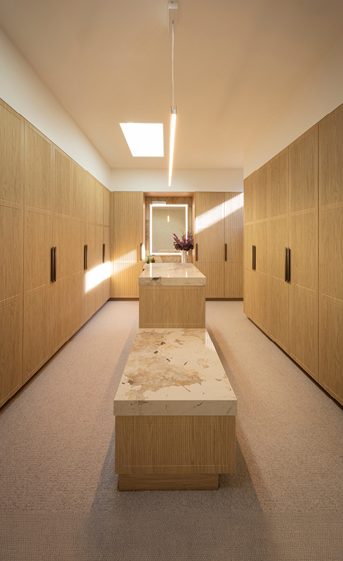 Adam and Jolene’s Nordic Oak walk in wardrobe with central stone island