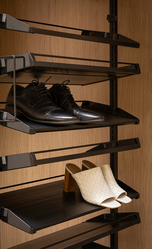 Rotating shoe rack inside Adam and Jolene’s Nordic Oak walk in wardrobe