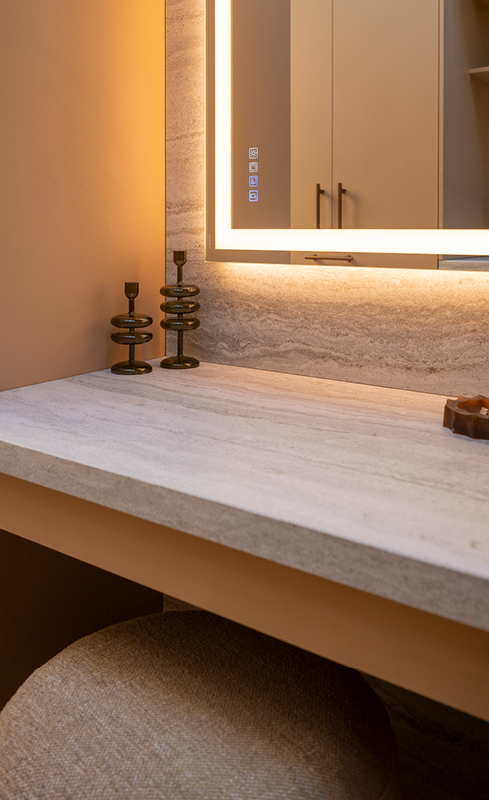 Illuminated Bluetooth mirror in Courtney and Sev’s dedicated wardrobe makeup zone
