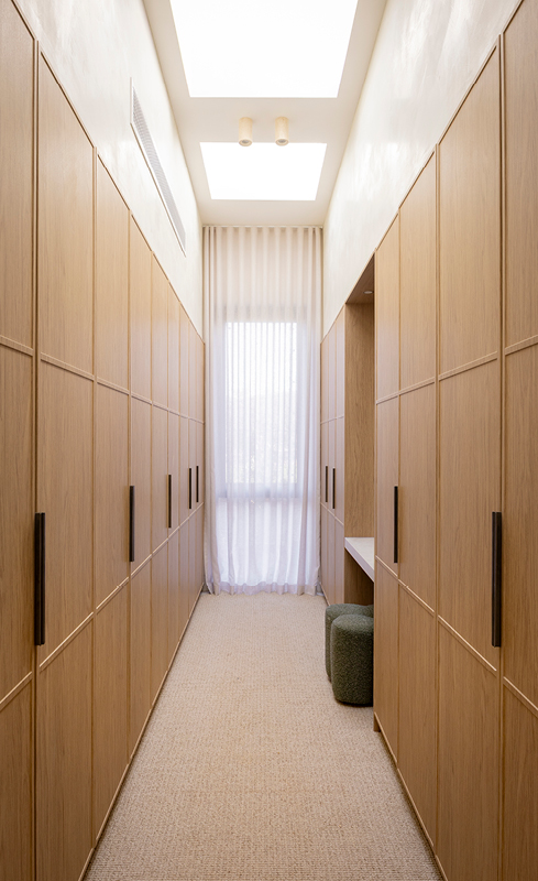 Rick and Tayla’s Nordic Oak walk-in wardrobe with textured Linea profile doors