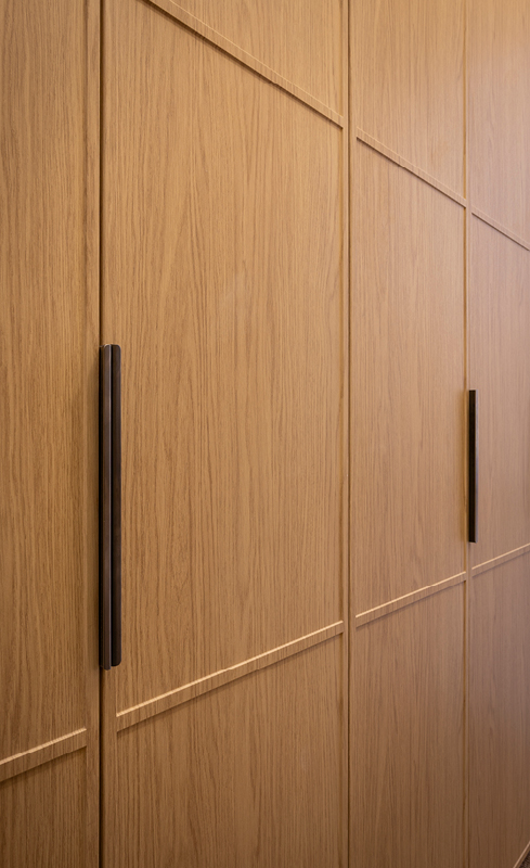 Linea profile Nordic Oak wardrobe doors with gunmetal handles