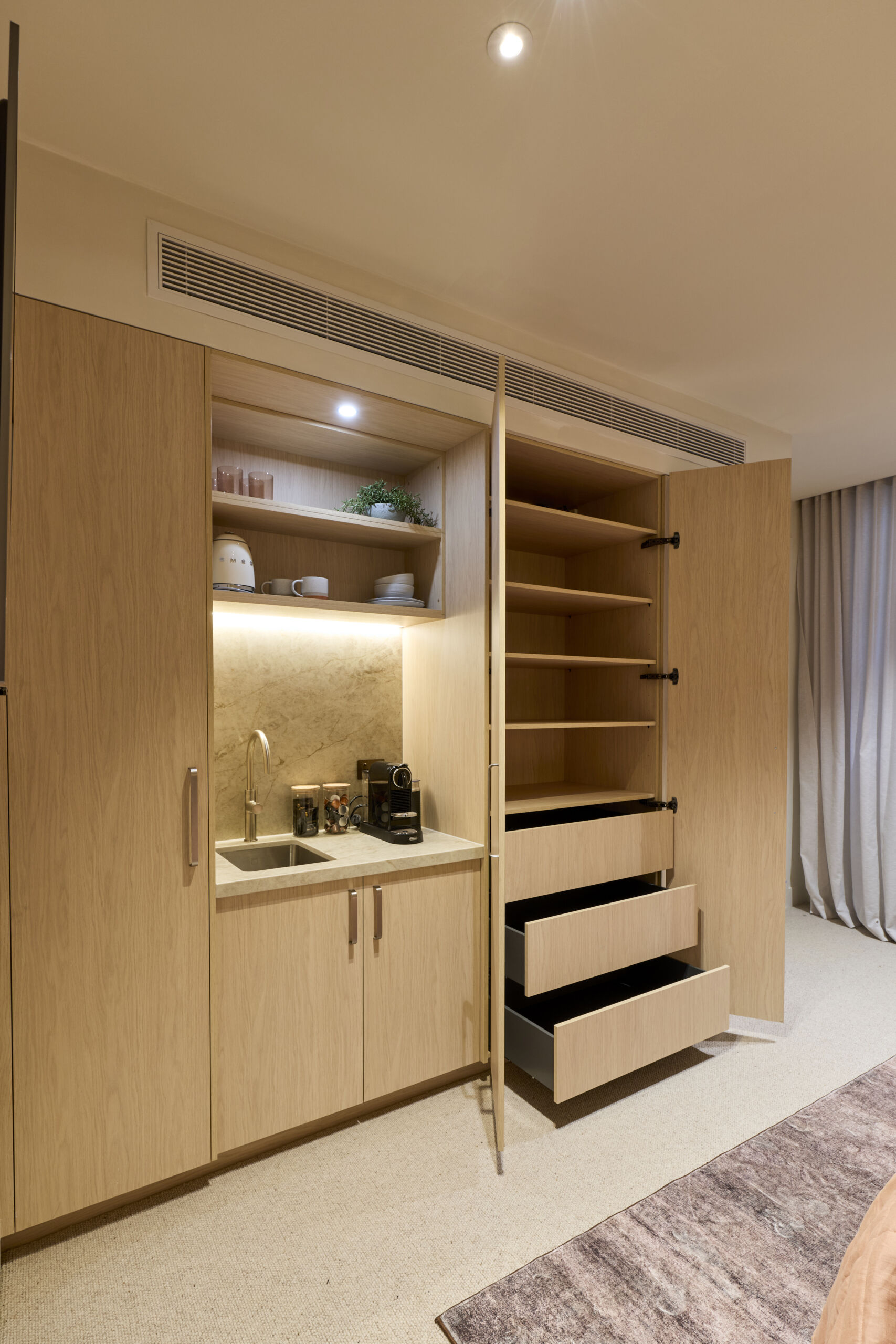 H4 RM6 GUEST SUITE BEDROOM & ENSUITE Courtney and Sev-081 Large built in wardrobe with bar area and drawers and open shelves.