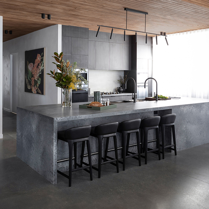 industrial-oct26-mob-2 Modern industrial kitchen with dark timber-look cabinetry, concrete-look waterfall island and black track lighting